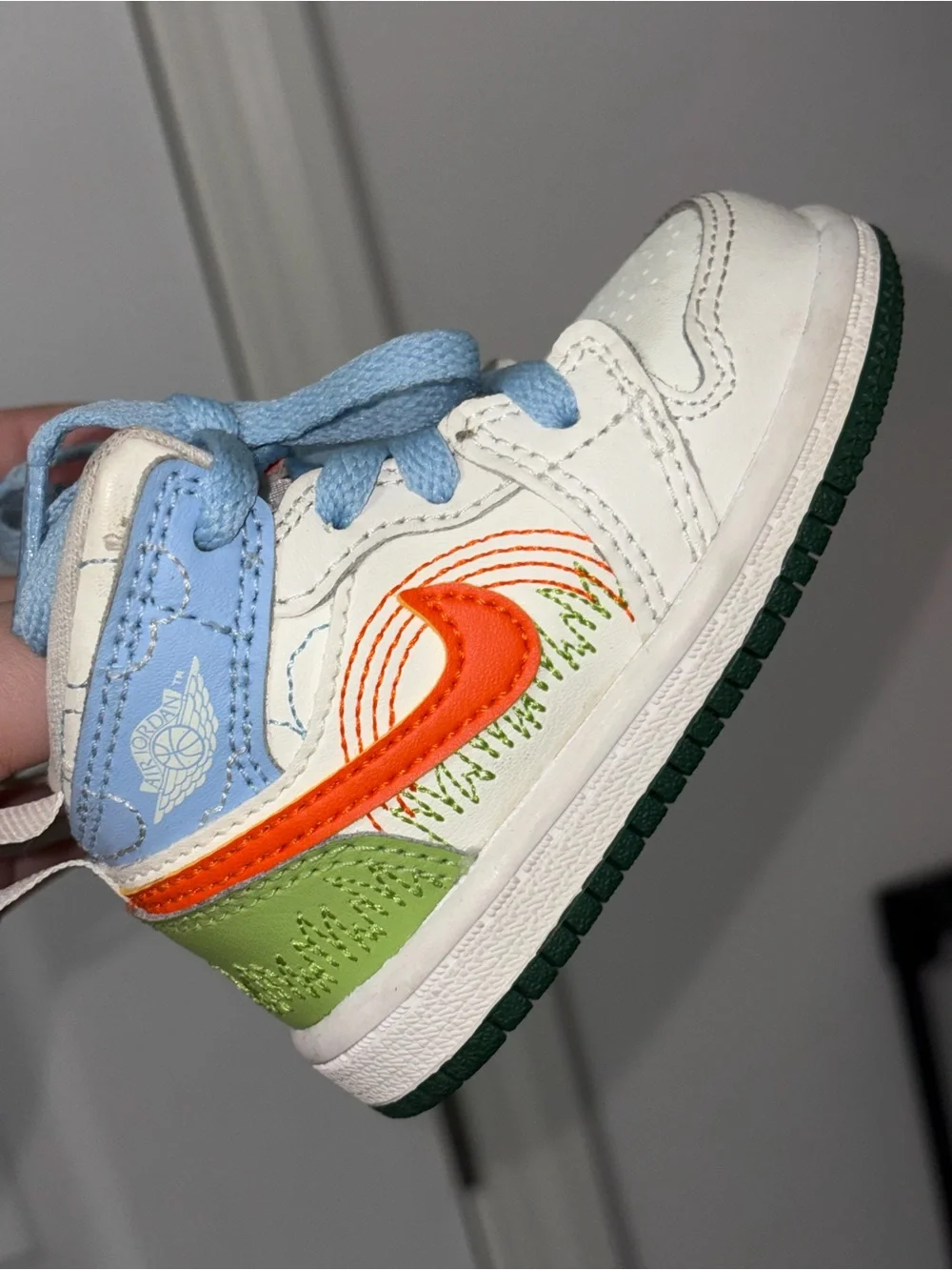 Jordan Kids White, Orange & Green High-Top Sneaker with Light Blue Accents